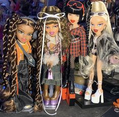 several dolls are lined up next to each other