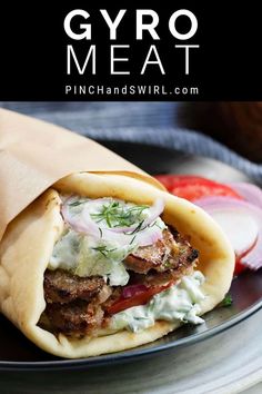 a pita filled with meat and vegetables on top of a plate