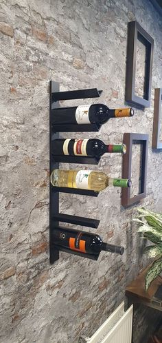 a wall mounted wine rack holding several bottles