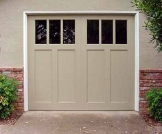 an image of a garage door with windows