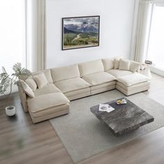 a living room with a sectional couch and coffee table