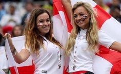 two women with their faces painted in the colors of england and england's flag