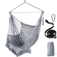 a gray hammock hanging from a white wall