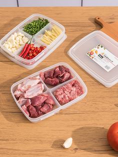 three plastic containers filled with food on top of a wooden table next to tomatoes and peppers