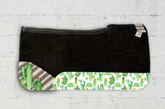 the cactus zipper pouch is made from black fabric