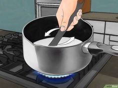 a person is stirring something in a pan on the stove