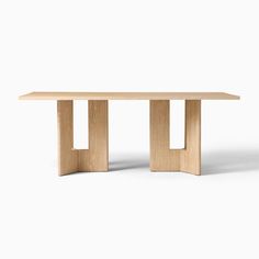 a wooden table sitting on top of a white floor