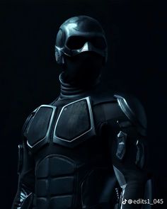 a man in a black suit and helmet