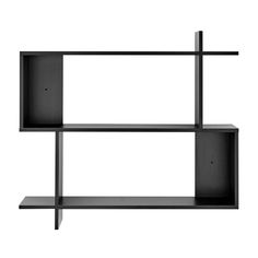 a black shelf with two shelves on each side and one is open to reveal the wall