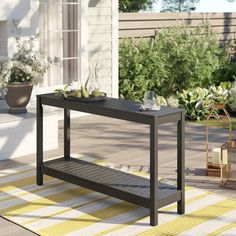 a table on a patio with some plants