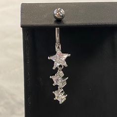 This Belly Button Ring Features A Silver Tone, With Three Star Shaped Jewels. Bellybuttonpiercing Y2k, Silver Belly Button Rings, Silver Star Belly Rings, Adjustable Silver Star Belly Ring, Summer Belly Rings, Belly Button Piercing Cute, Belly Piercings, Bellybutton Piercings, Mickey Earrings