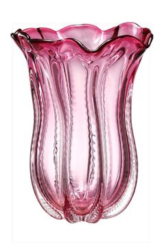 a pink glass vase sitting on top of a table