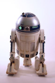 a toy robot that is sitting on the ground