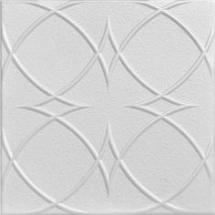 a white ceiling tile with an intricate design