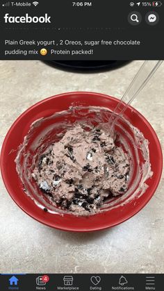 a red bowl filled with ice cream on top of a table