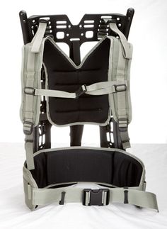 the back view of a backpack with straps and buckles on it, sitting against a white background