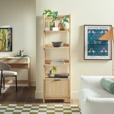 a living room with a white couch and wooden shelves