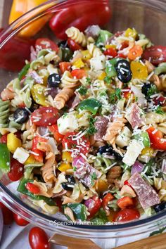 pasta salad with tomatoes, olives, mozzarella and parmesan cheese