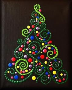 a colorful christmas tree made out of beads