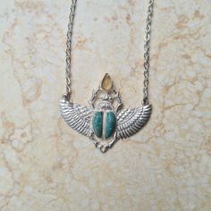 Connect to your Ancient Egyptian roots with one of these spectacular pieces. Wear these powerful amulets to promote the divine within us all. These are limited-edition pieces ✿»☤♕☤«✿ Size & Material ✿»☤♕☤«✿ The necklaces are brass, silver-plated or gold-plated, and are often combined with one or more gemstonesSizes are approximately 4 cm x 3 cm Winged Scarab Necklace, Osiris Necklace, Wooden Feather, Bird Skull, Amulets, Pendant Rings, Hair Sticks, The Divine, Ancient Egyptian