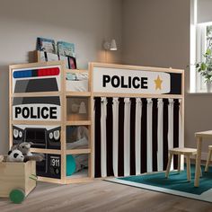 a child's room with a police themed bed and toy storage unit in the corner