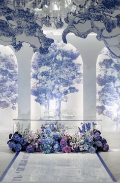 an artistic display with blue and purple flowers