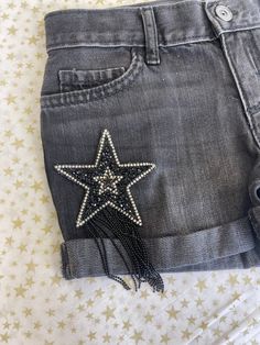 Yeehaw! The perfect denim shorts for summer are here! Beautiful star rhinestone tassel patches adorn the front of these shorts. Perfect paired with cowboy boots and a crop like our Bardot tee. Measurement chart is provided in photos. Shorts For Summer, Diy Shorts, Perfect Denim, Jeans For Short Women, Summer Is Here, Custom Shorts, Beaded Accessories, Measurement Chart, Black Denim Shorts