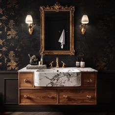 a bathroom sink sitting under a mirror next to a wall mounted faucet with lights on it