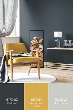 a living room with gray walls and yellow accents