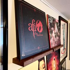 several framed movies are hanging on the wall