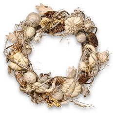 a white wreath with pine cones and acorns