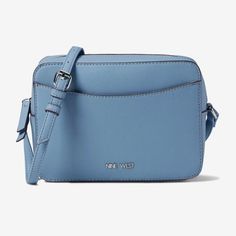 Carry Your Things Hassle-Free In The Nine West Calandra Crossbody Bag. Sku: #9736905 Leather Construction. Zippered Closure. One Interior Zippered Pocket. One Interior Slip Pocket. Lining: Polyvinyl. Imported. Measurements: Bottom Width: 2 12 In Depth: 7 In Height: 6 In Strap Length: 51 In Weight: 10 Oz Casual Blue Shoulder Bag For Office, Casual Blue Bags For Workwear, Casual Blue Bags For Work, Bagged Milk, Evening Purse, Chatelaine, Nine West, Purses Crossbody, Camera Bag