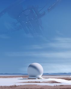 a large white ball sitting on top of a sandy beach next to an airplane in the sky