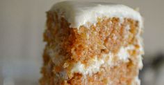 a piece of carrot cake with white frosting