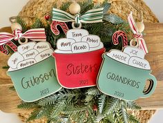 three personalized christmas ornament hanging from a basket