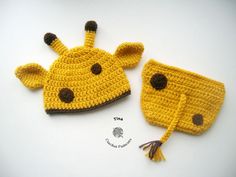 two crocheted giraffe hats with tassels