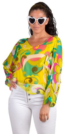 Dolman Sleeve Silk Crop Top with Groovy Abstract Print. Features a Stretch Interior Lining. 30% Silk, 70% Viscose Exterior | 95% Viscose, 5% Elastic Interior Made in Italy One size fits most Model 5'7" Flowy Vibrant Print Blouse, Summer Long Sleeve Blouse With Vibrant Print, Green Flowy Trendy Top, Trendy Green Flowy Top, Vibrant Printed Green Tops, Vibrant Green Printed Tops, Chic Turquoise Top For Beach, Chic Turquoise Beach Top, Vibrant Long Sleeve Blouse For Vacation