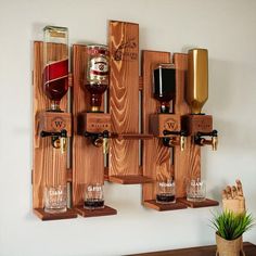 AsrinCo Cheers to Your Home: The Personalized Wooden Liquor Dispenser Celebrate your love for home and each other with this unique, handcrafted liquor dispenser!Featuring a stunning wooden design, this dispenser is personalized with your home coordinates, transforming your bar into a unique and sentimental space. Imagine:Your favorite spirits flowing from a dispenser that represents your journey together. It's more than just a functional piece; it's a symbol of your love, a conversation starter, and a beautiful reminder of the place you call home. Here's what makes this dispenser truly special: Personalized Coordinates:Capture the essence of your shared journey by engraving your home coordinates into the beautiful wooden design. Elegant Wall Mount:Designed for effortless wall display, addi First Home Gifts, Custom Wedding Gifts, Wooden Design, Decanters, Shot Glasses, Bottle Holders, Wall Display