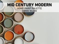 several paint cans with different colors on them and the words mid century modern home paint palette