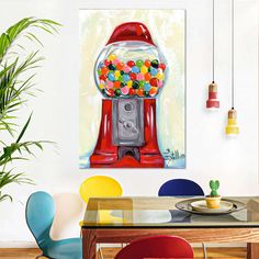 a painting of a red gummy machine on a wall above a dining room table