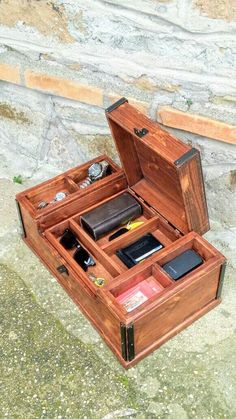 an open wooden box sitting on the ground