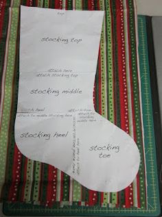 a piece of paper that has been folded into a christmas stocking ornament