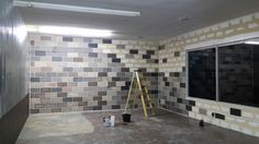 a room that is being remodeled with tile on the walls