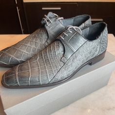 These Are Rare, Genuine Alligator Shoes, Hand Made In Italy, In Gently Used Condition. Color- Light Grey. Size 10 Us, However They Run Large, More Like A 10.5 Or 11. Shoes Will Come In Their Original Box. They've Been Stored In The Box With Shoe Trees Since Purchase So They've Maintained Excellent Shape. The Alligator Skin Material Is Super Soft And Supple. There Are Signs Of Wear On The Bottom Leather Soles, However No Obvious Signs Of Wear Anywhere Else. Leather Crocodile Pattern Lace-up Dress Shoes, Designer Leather Wingtip Shoes With Textured Sole, Leather Lace-up Dress Shoes With Crocodile Pattern, Designer Wingtip Leather Shoes With Textured Sole, Leather Cap Toe Dress Shoes With Crocodile Pattern, Leather Dress Shoes With Crocodile Pattern Cap Toe, Luxury Crocodile Pattern Leather Lace-up Shoes, Luxury Lace-up Leather Shoes With Crocodile Pattern, Luxury Crocodile Pattern Lace-up Leather Shoes