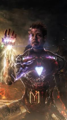 iron man holding his hands up in front of an image of the avengers movie character