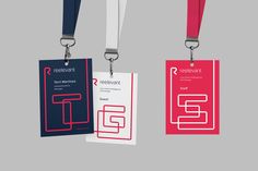 three lanyards with red, white and blue tags attached to each one's neck