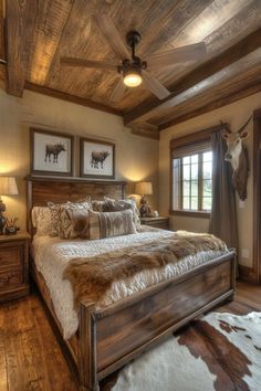 a bed room with a neatly made bed and cowhide rugs on the floor