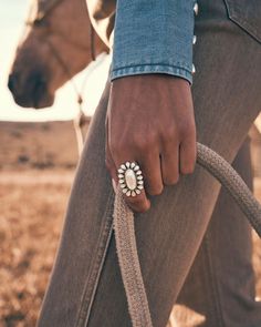 Be the talk of the town (or rodeo!) with the Wrangler® x Yellow Rose by Kendra Scott Laurel Vintage Gold Statement Ring in Ivory Mother of Pearl. The ring’s floral silhouette combines iconic Kendra Scott shapes and design details with Southwest-inspired materials for a one-of-a-kind ring you won’t see anywhere else. No matter where you are, you’re going to want to roll up your sleeves and let this statement maker shine. This ring is part of the Wrangler® x Yellow Rose by Kendra Scott collection,