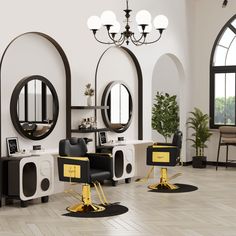 the salon is decorated in black and white with gold trimmings on the chairs