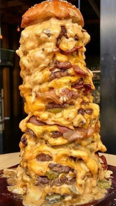 a stack of food sitting on top of a wooden table